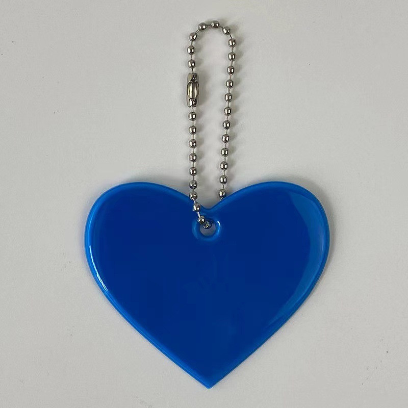 Sirds formas atstarojošs kulons atslēgu piekariņu somas Aksesuāri labi pamanāmi PVC atstarotāji atslēgu piekari Mugursomas dāmām bērnu drošība