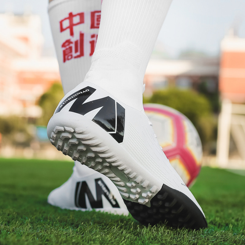 Karstā izpārdošana Vīriešu futbola skavas ar augstu potīti, futbola apavi ar gariem tapas āra futbola treniņzābaki vīriešiem sieviešu futbola apavi
