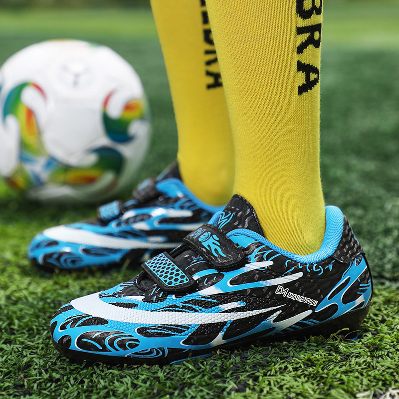 Karstā izpārdošana Zili sarkani FG/TF bērnu futbola zābaki āra Neslīdoši bezšņģīņu futbola apavi pusaudžiem Skolas kedas bērniem zēniem