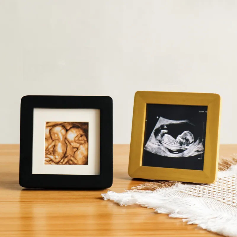 Četru dimensiju krāsu ultraskaņas attēls ar mazuļa masīvkoka biroja darbvirsmas mazu fotoattēlu rāmi, bērna augšanas rekorda foto rāmis