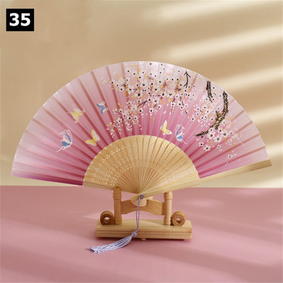 Vintage saliekamais ventilators ķīniešu klasiskais roku ventilators kāzu deju ballītes dekorēšanai. Ornaments japāņu mājas dekors