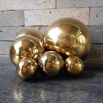 Uus tulekul roostevabast terasest titaanist kullast õõnsate pallide õmblusteta kodu- ja aiakaunistus peegelkuuliga peokaunistus