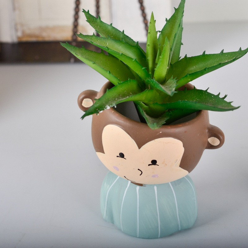 Aranyos ferde fejű baba rajzfilm kis állat aranyos kisállat virágcserép web híresség hálószoba asztaldísz darab zamatos zöld terv