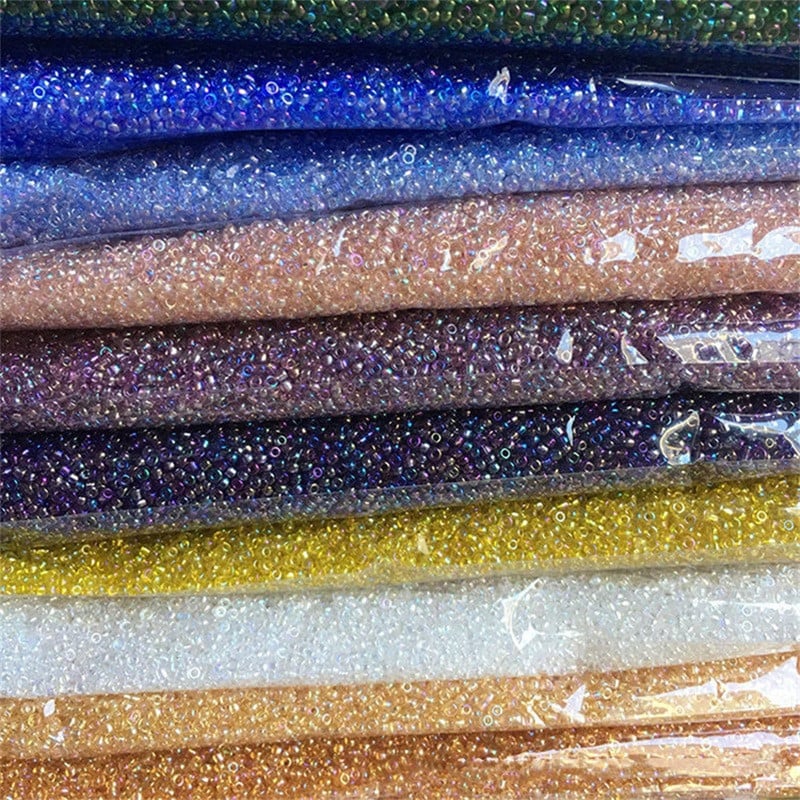 Daudzizmēru 1,5–4 mm stikla rīsu krelles burvju krāsas caurspīdīgas imitācijas Nissan krāsu izkaisītas krelles, kas izgatavotas ar savām rokām, pušķu aksesuāri