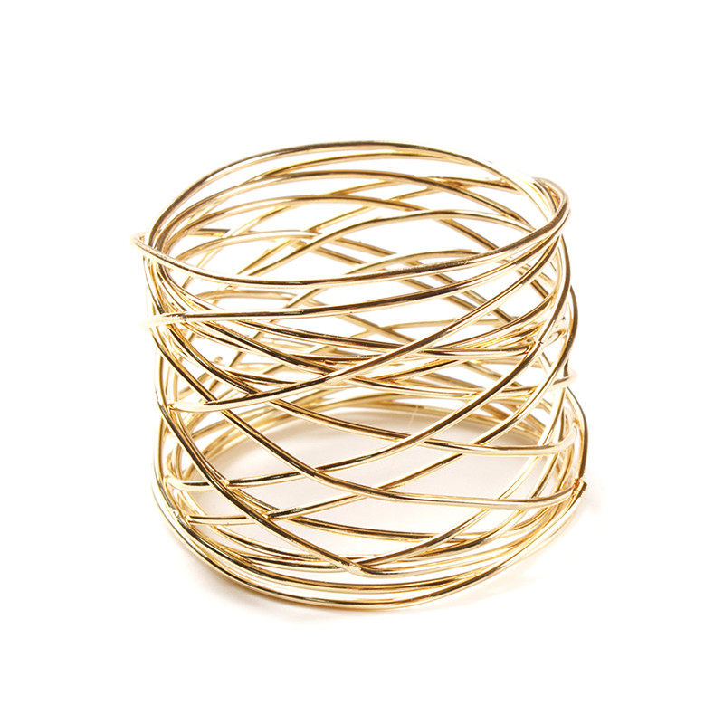 1 vnt. platus apvalus auksinis servetėlių žiedas, metalinis kryžminis tuščiaviduris drožtinis servetėlių laikiklis stalui