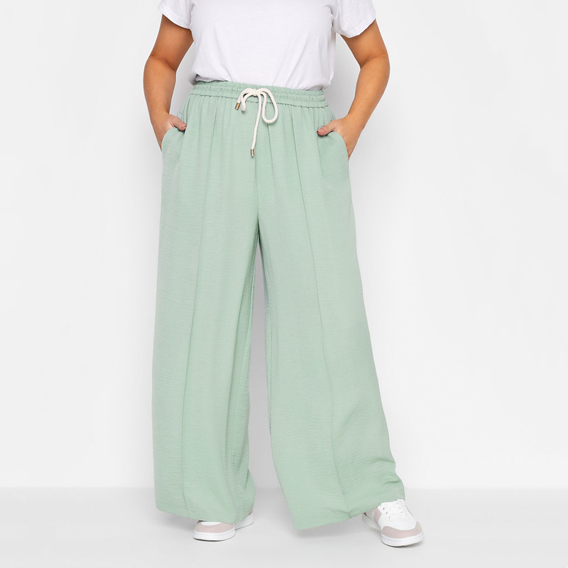 Liela izmēra elastīga aukliņa viduklis Vasaras brīvs Elegantas platas bikses kabatas pusē Vieglas gadījuma taisnas bikses 4XL 5XL