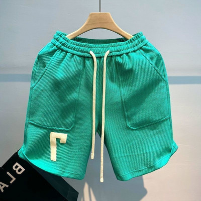 Korea stiilis soliidsed lühikesed püksid meestele suvised mitmekülgsed vabad spordipüksid vabaaja trendikad suvepüksid meeste rannastiilis lauapüksid