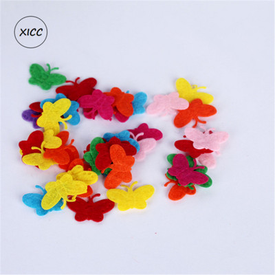 100 gab. Neausti smaida ziedi tauriņi vilnas filca audums matu virve DIY roku darbs aksesuāru uzlīmes aplikācijas ielāpi Filca paliktnis