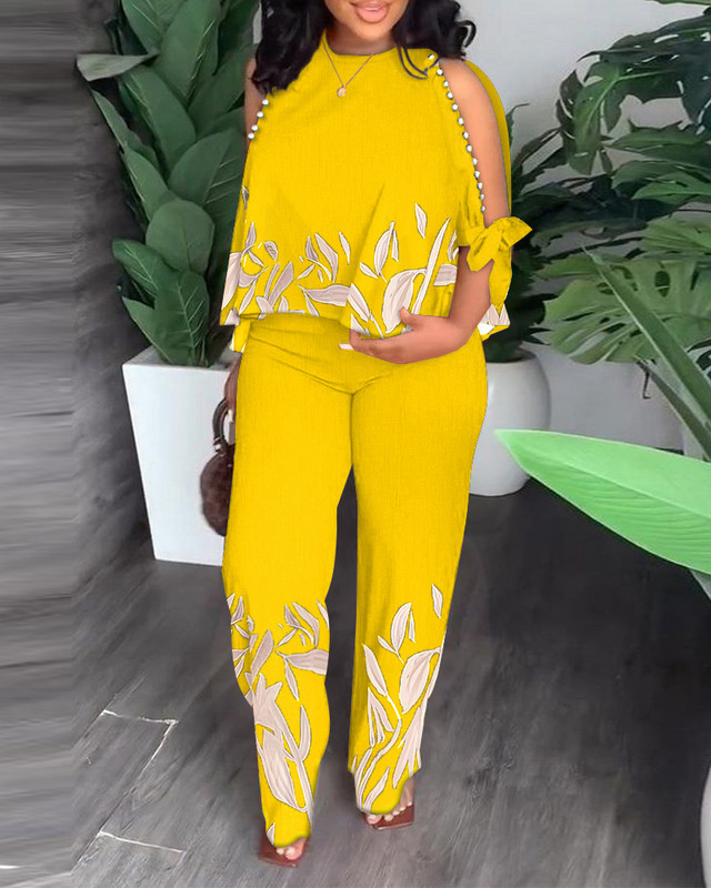 Nyári divat, elegáns, nyomtatott kétrészes női szett szexi üreges fűzős rövid ujjú, széles szárú nadrág, kétrészes női szett