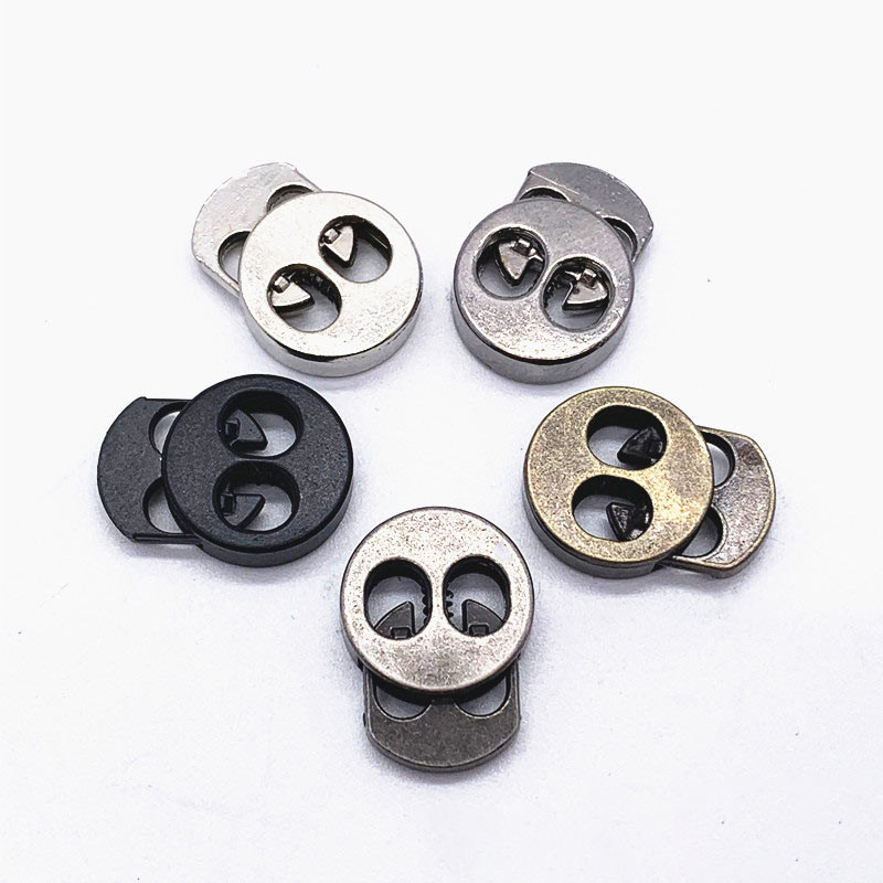 10 gab. Metāla auklas slēdzenes aizbāznis, kas paredzēts apģērbam, kurpju auklai, mugursomai, sporta apģērbam, DIY piederumiem, diviem caurumiem 15 * 19 * 5 mm