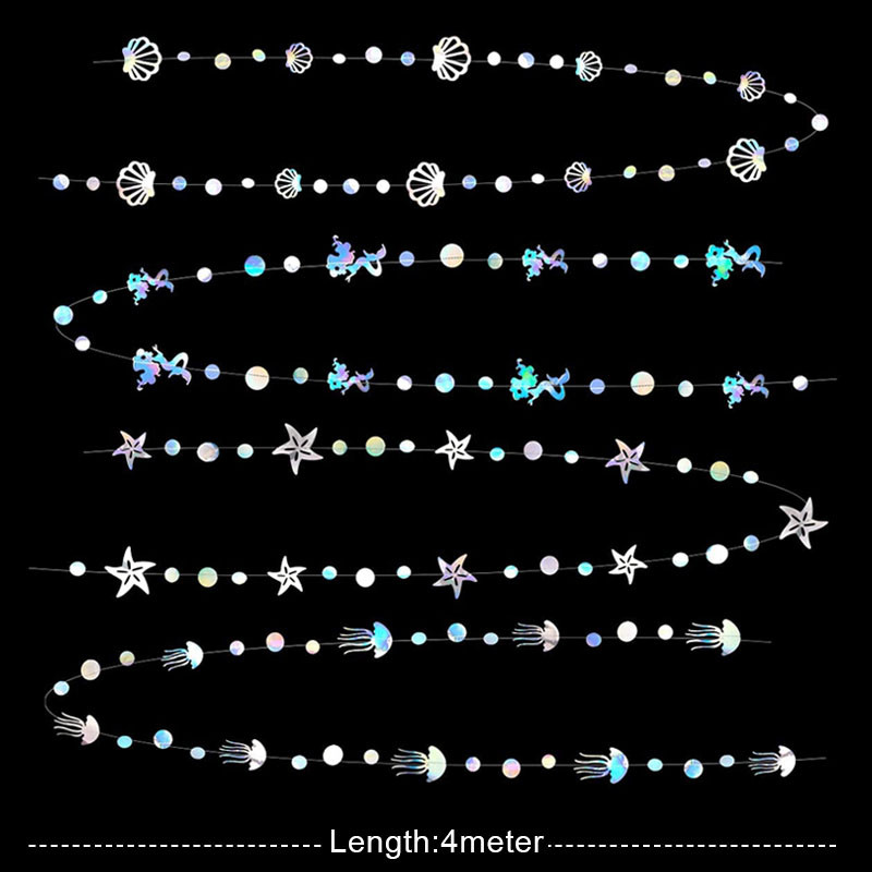 Zaigojošas nāriņas dzimšanas dienas baneri zem jūras ballītes piekārtiem rotājumiem jūraszvaigznes medūzas papīra vītnes bērnu dušas meitene