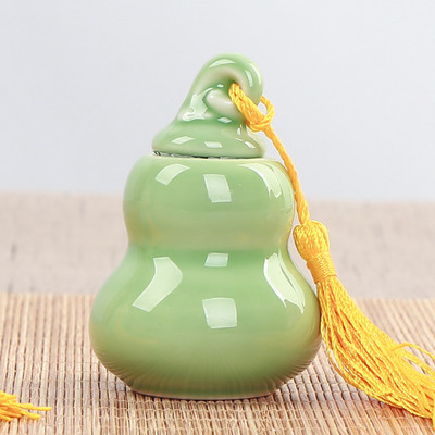 Pārnēsājams persiku keramikas tējas Caddy radošs noslēgts katls Sarkanā zaļā tēja Pu'er tējas uzglabāšana Tējas trauks Tējas skārde