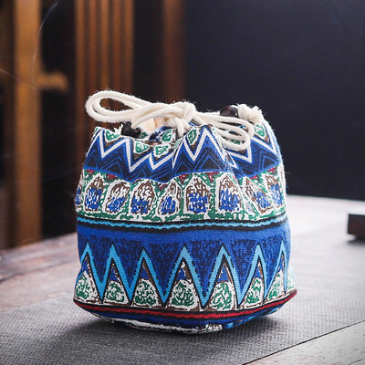 Daudzfunkcionāls ceļojumu tējas trauku glabāšanas maisiņš.