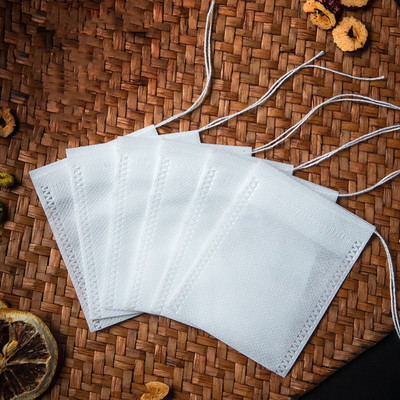 Eldobható teászacskók 100 db/tétel Üres nem szőtt, húzózsinóros zacskó 5,5x7 cm-es pecsétszűrős, fűszernövény fűszeres laza kávézacskós eszköz