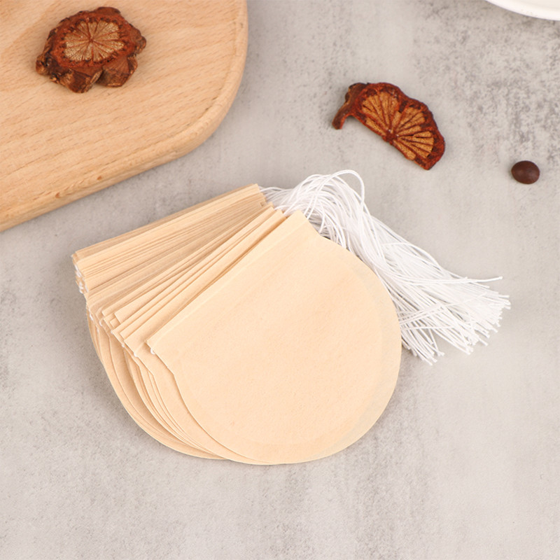 50 gab. Apaļš tējas maisiņš Tējas maisiņš papīra savilkšanas aukliņas Eko filtrs Tukšs birstošo lapu pulvera garšaugu filtrs