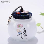 Pārnēsājamas ceļojumu matētas smērvielas, baltas keramikas, aizzīmogotas uzglabāšanas burka kafijas pupiņu tēja, konfekšu cepumi, pārklāti virtuves uzglabāšanas pudeļu kārbas