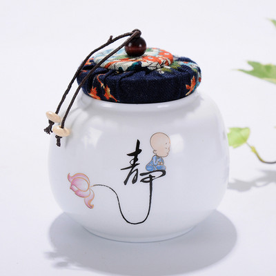 Pārnēsājamas ceļojumu matētas smērvielas, baltas keramikas, aizzīmogotas uzglabāšanas burka kafijas pupiņu tēja, konfekšu cepumi, pārklāti virtuves uzglabāšanas pudeļu kārbas