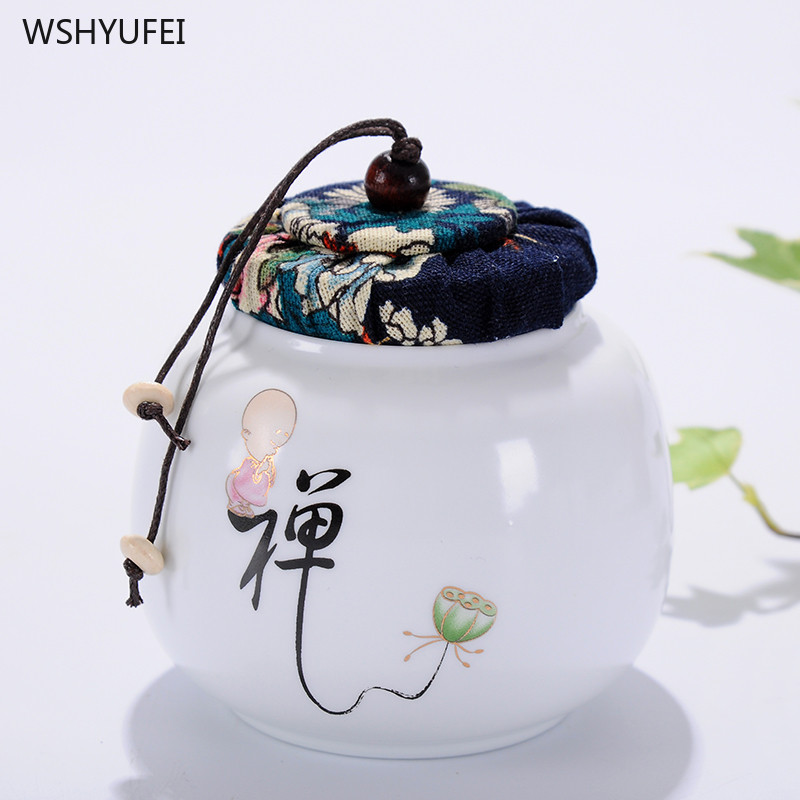 Pārnēsājamas ceļojumu matētas smērvielas, baltas keramikas, aizzīmogotas uzglabāšanas burka kafijas pupiņu tēja, konfekšu cepumi, pārklāti virtuves uzglabāšanas pudeļu kārbas