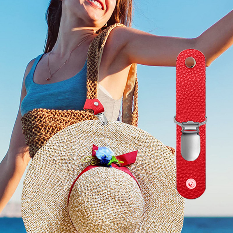 Spalvingas skrybėlių laikiklis, skirtas kelioniniam krepšiui, kuprinei ir kitiems rankinės priedams