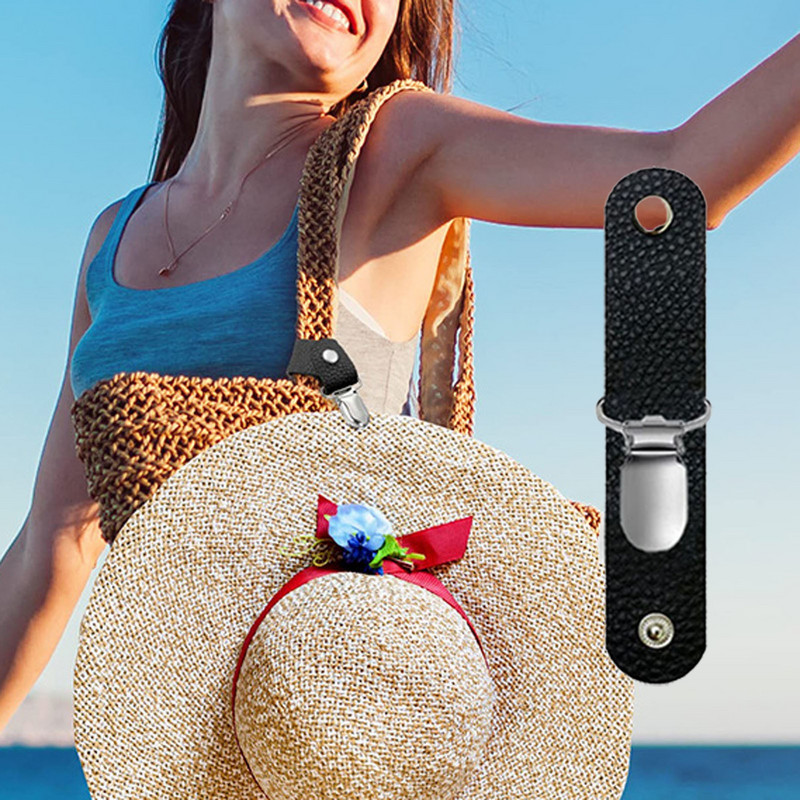 Spalvingas skrybėlių laikiklis, skirtas kelioniniam krepšiui, kuprinei ir kitiems rankinės priedams