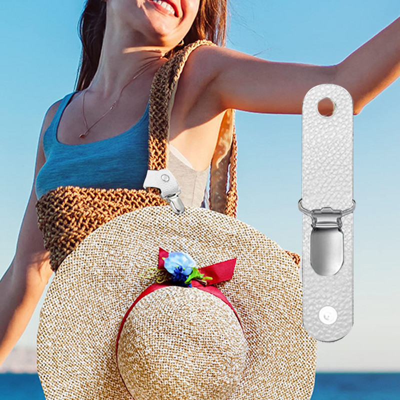 Spalvingas skrybėlių laikiklis, skirtas kelioniniam krepšiui, kuprinei ir kitiems rankinės priedams