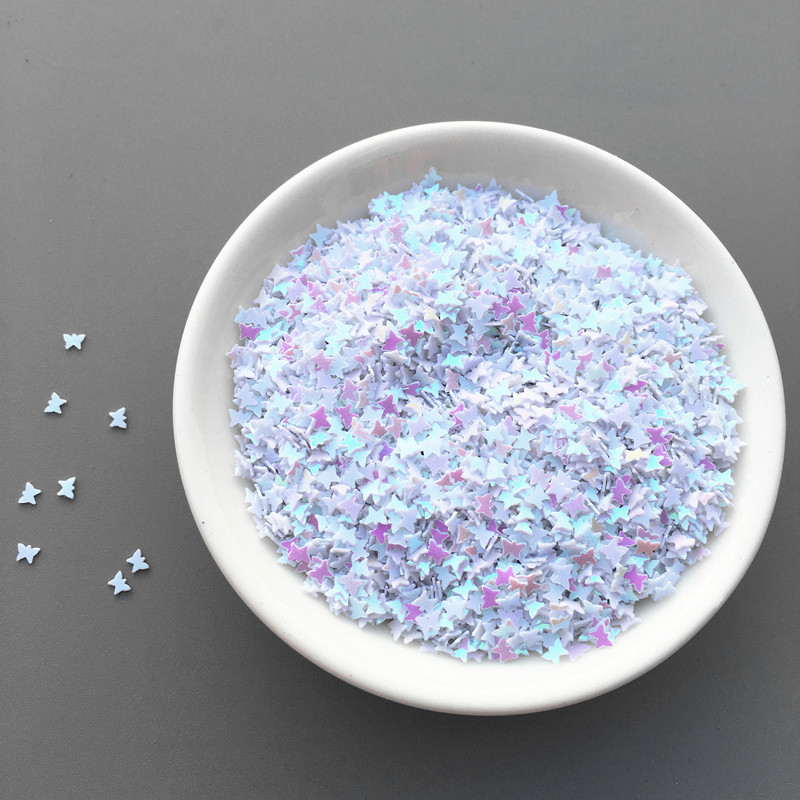 10 g/partija 3 mm mazi tauriņa formas vizuļi, kas paredzēti rokdarbiem, kas paredzēti nagu mākslas manikīram/kāzu dekorēšanai.