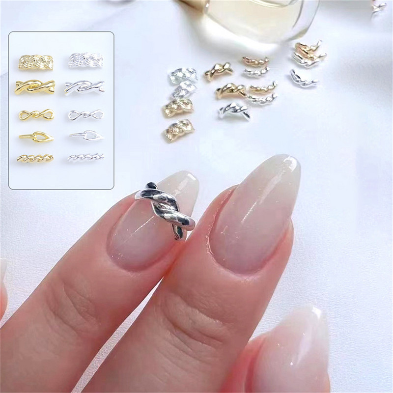 20 komada Japanski 3D Twist Aluminijski Nail Art privjesci Zlatni Srebrni svjetlucavi Legirani klinovi Dodaci Uže Pojas Čvorovi Dijelovi za nokte Dekoracija