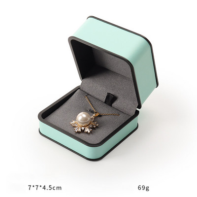 Ehtekarp kõrgekvaliteedilisest PU-nahast moodne ümmargune nurk, must äärega sõrmus kaelakee karbi klapiga ehtepakendite karbid äri jaoks