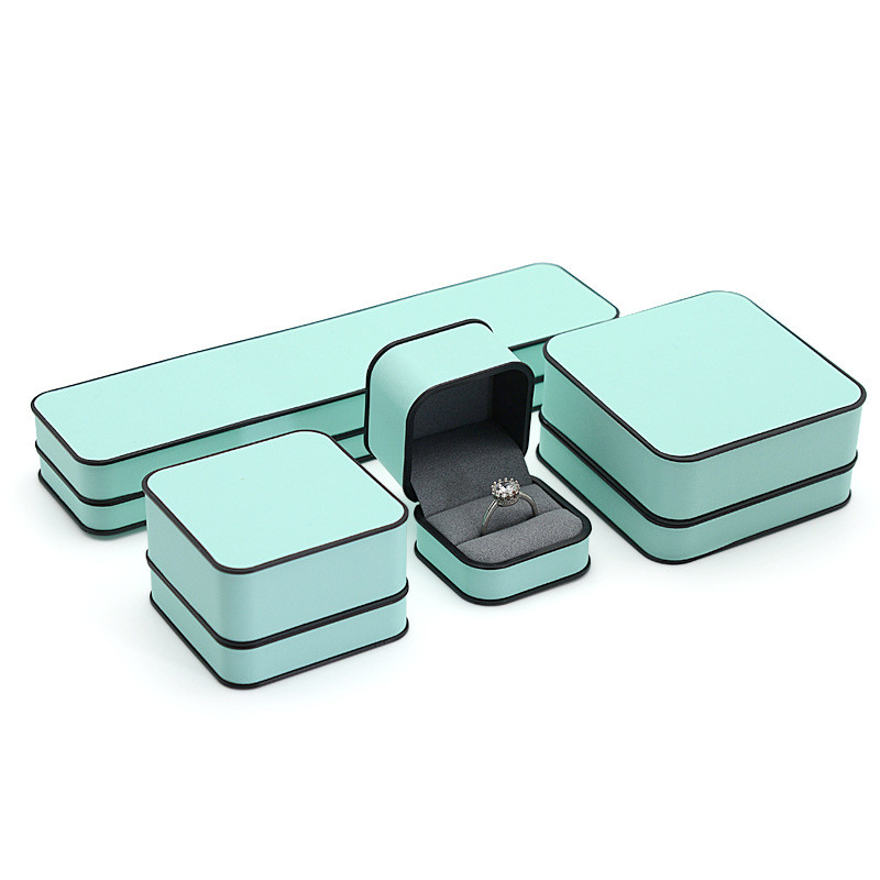 Ehtekarp kõrgekvaliteedilisest PU-nahast moodne ümmargune nurk, must äärega sõrmus kaelakee karbi klapiga ehtepakendite karbid äri jaoks