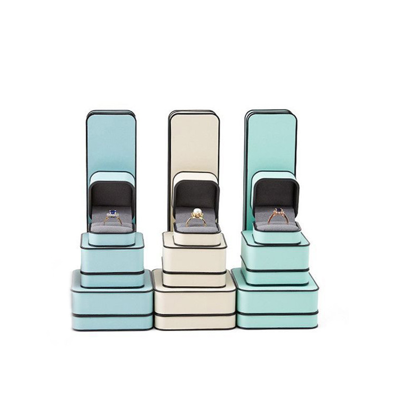 Ehtekarp kõrgekvaliteedilisest PU-nahast moodne ümmargune nurk, must äärega sõrmus kaelakee karbi klapiga ehtepakendite karbid äri jaoks