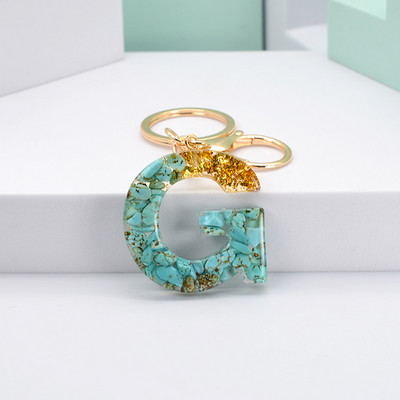 Νέο μοντέρνο γράμμα κρεμαστό μπρελόκ από ρητίνη εποξειδική τσάντα κρεμαστό μενταγιόν Δημιουργικό δημοφιλές Πράσινο πέτρινο μπρελόκ Μπρελόκ Χονδρική