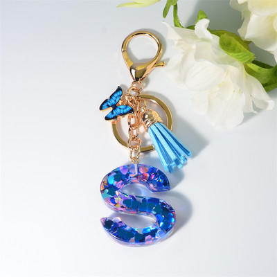 Μπρελόκ με 26 γράμματα μπρελόκ για γυναικεία τσάντα ντεκόρ με παγιέτα με γέμιση 26 γραμμάτων Μόδα μενταγιόν μπλε πεταλούδα με μπρελόκ Δώρα φιλίας