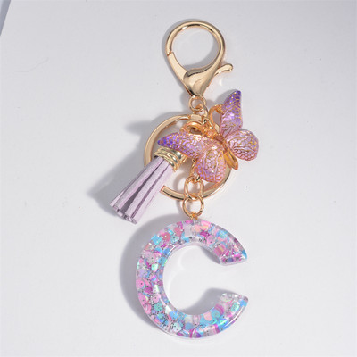 Μπρελόκ με αρχικό γράμμα για γυναίκες Φούντα πεταλούδα μωβ Χαριτωμένο μπρελόκ αυτοκινήτου για γυναικεία κοριτσίστικα πορτοφόλια στολίδια σακίδιο πλάτης