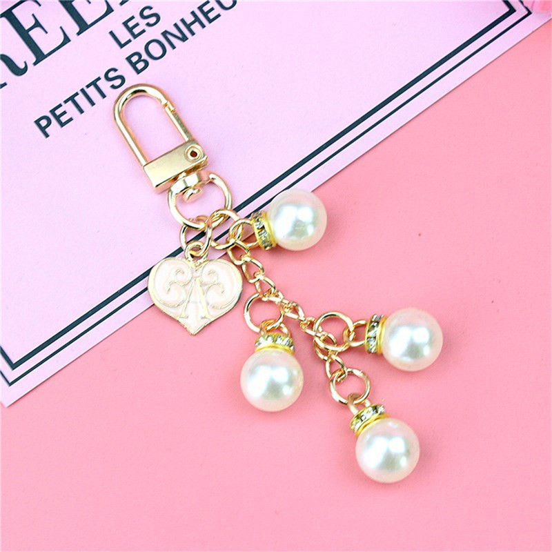 Uus võltspärl-roosa virsiku-südamesulamist võtmehoidja ripats naistele Kingitus Loominguline Teemant-Parfüüm Metallist Aksessuaarid Kotidekoratsioon