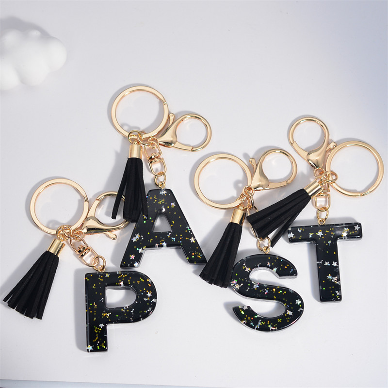 Mystery Black 26 γράμματα Μπρελόκ Shine Stars πούλιες Μπρελόκ από ρητίνη για θήκη αυτοκινήτου Φούντα μπρελόκ Γυναικεία τσάντα γούρι