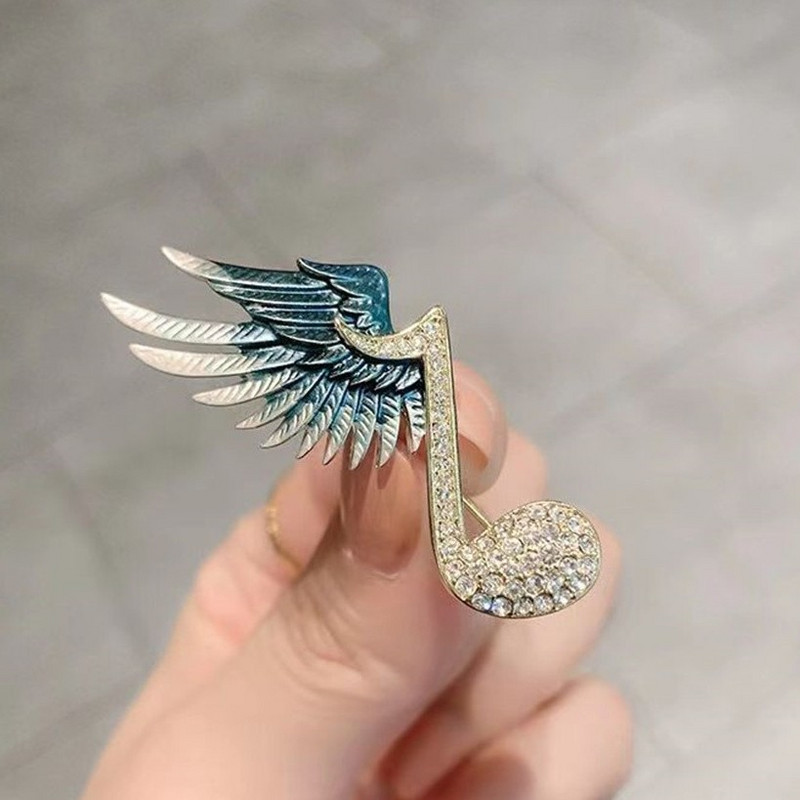 Μουσική νότα Μεταλλική στρας καρφίτσα μόδας φτερά πόρπης καρφίτσα πέτο Πολυτελή κοσμήματα ιδιοσυγκρασία Γυναικείες καρφίτσες Αξεσουάρ