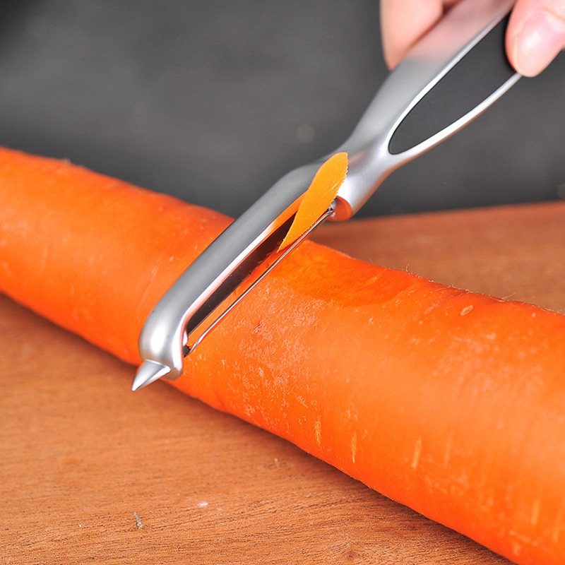 Sűrített hámozó Konyhai zöldség rozsdamentes acél dinnyegyalu Kétfejes hámozó Háztartási többfunkciós gyümölcshámozó