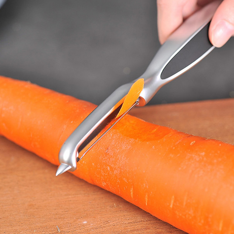 Sűrített hámozó Konyhai zöldség rozsdamentes acél dinnyegyalu Kétfejes hámozó Háztartási többfunkciós gyümölcshámozó