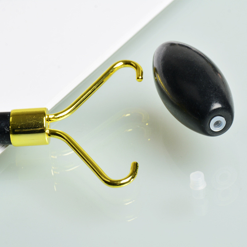 Masažni valjak za lice od opsidijana. Crni valjak za lice. Valjak od crnog žada. Masažer za lice od prirodnog obsidijana. Crni valjak za masažu lica.