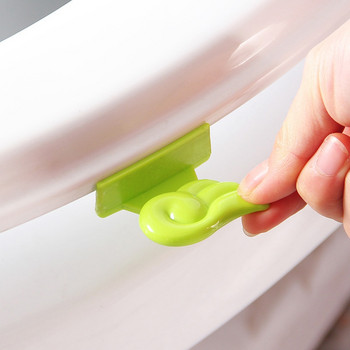 Повдигащо устройство Гладък държач Чисто сладко крило Издръжливи хигиенни ръчни консумативи за седалка Повдигач на капака на тоалетната Мида 2 цвята