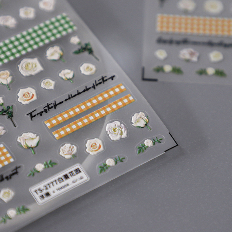 Valged roosiõied 5D pehmed reljeefsed reljeefid Isekleepuvad küünekleebised Kollase rohelise ruudulise mustriga 3D maniküüri kleebised