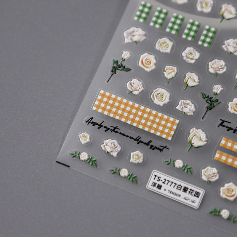 Valged roosiõied 5D pehmed reljeefsed reljeefid Isekleepuvad küünekleebised Kollase rohelise ruudulise mustriga 3D maniküüri kleebised