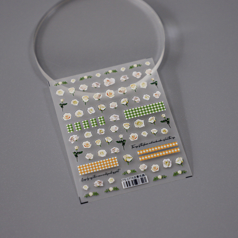 Valged roosiõied 5D pehmed reljeefsed reljeefid Isekleepuvad küünekleebised Kollase rohelise ruudulise mustriga 3D maniküüri kleebised
