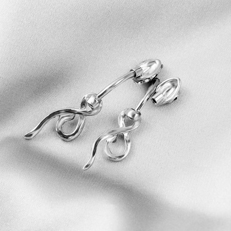 Európai és amerikai divatos rozsdamentes acél szegecses cirkon köldök köröm személyre szabott kígyó alakú tekercses köldökgombos piercing