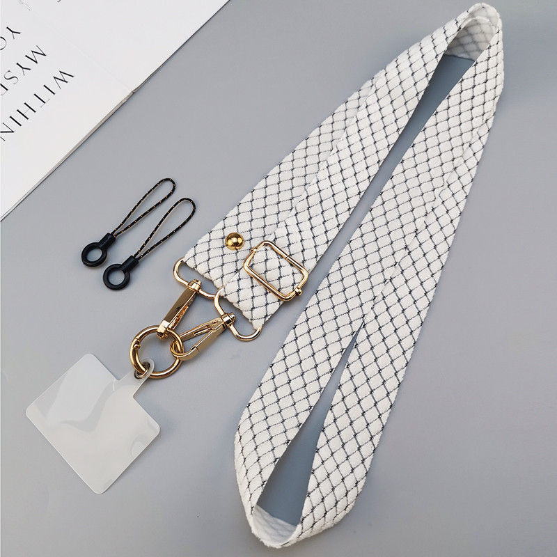 Mobiiltelefoni kaelapael, ristkorpuse reguleeritav tagakülg koos karusnahaga ruudulise mobiiltelefoni ümbrisega rippuv kott, pikk diagonaalklambriga kaelarihma kett