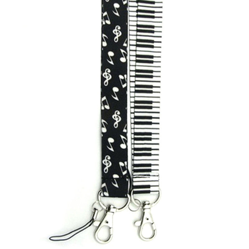 Minkšti fortepijono klavišai, patvarūs, „pasidaryk pats“ aksesuarai, rankoje laikomi pakabinami užrašai Pradžia Mobiliojo telefono dirželiai