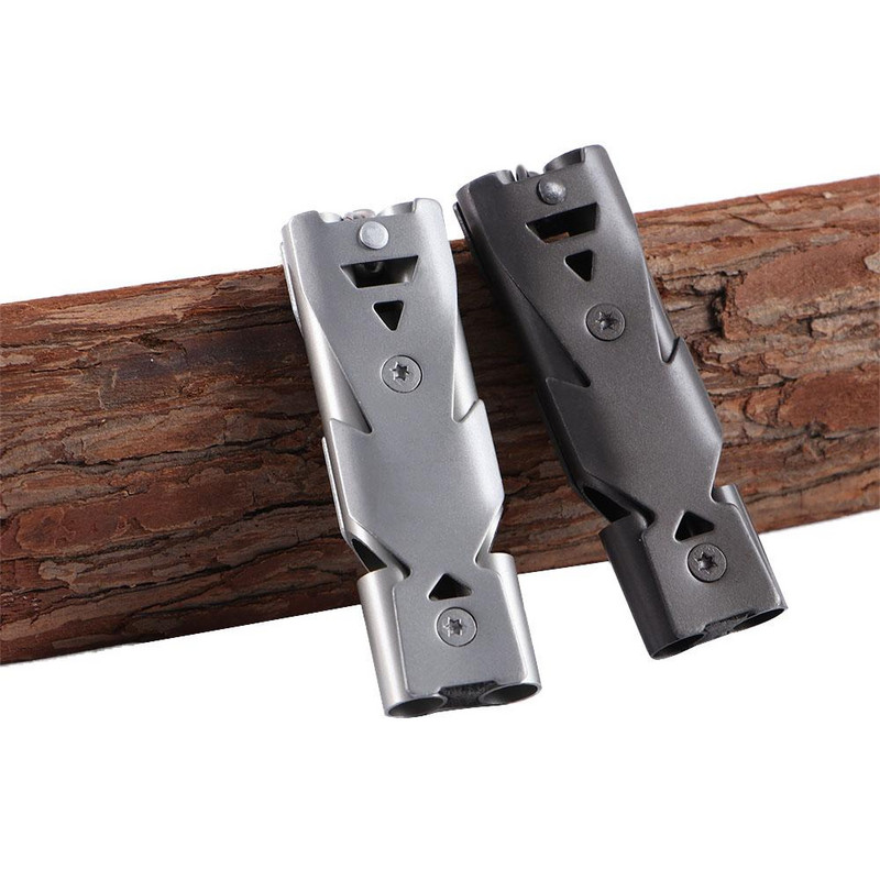 Pārnēsājams nerūsējošā tērauda āra izdzīvošanas svilpes divcauruļu augstas decibelu atslēgu piekariņš