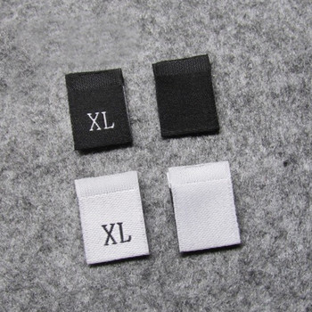 100Pcs XXS-7XL Етикет с размер на облекло Черен текст Бяла дреха Тениска Рокля Етикет от плат Плат Етикет Направи си сам Ръчно изработени шевни аксесоари