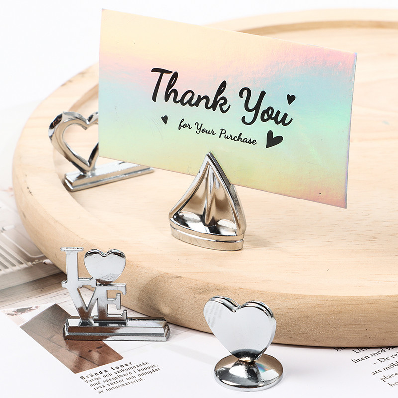 Popieriaus spaustukas Kortelių laikiklis Stalo numeris Laikiklis Stovas Pavadinimas Sėdimosios etiketės Plakatų spaustukai Nuotraukų Paveikslėlių Kortelės Vitrinos Stovas