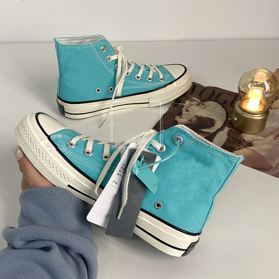 Unisex kõrged naiste lõuendjalatsid Meeste vabaaja sörkimisjalatsid Tudengite Vulcanize kingad Nööritavad naiste tossud Zapatos De Mujeres